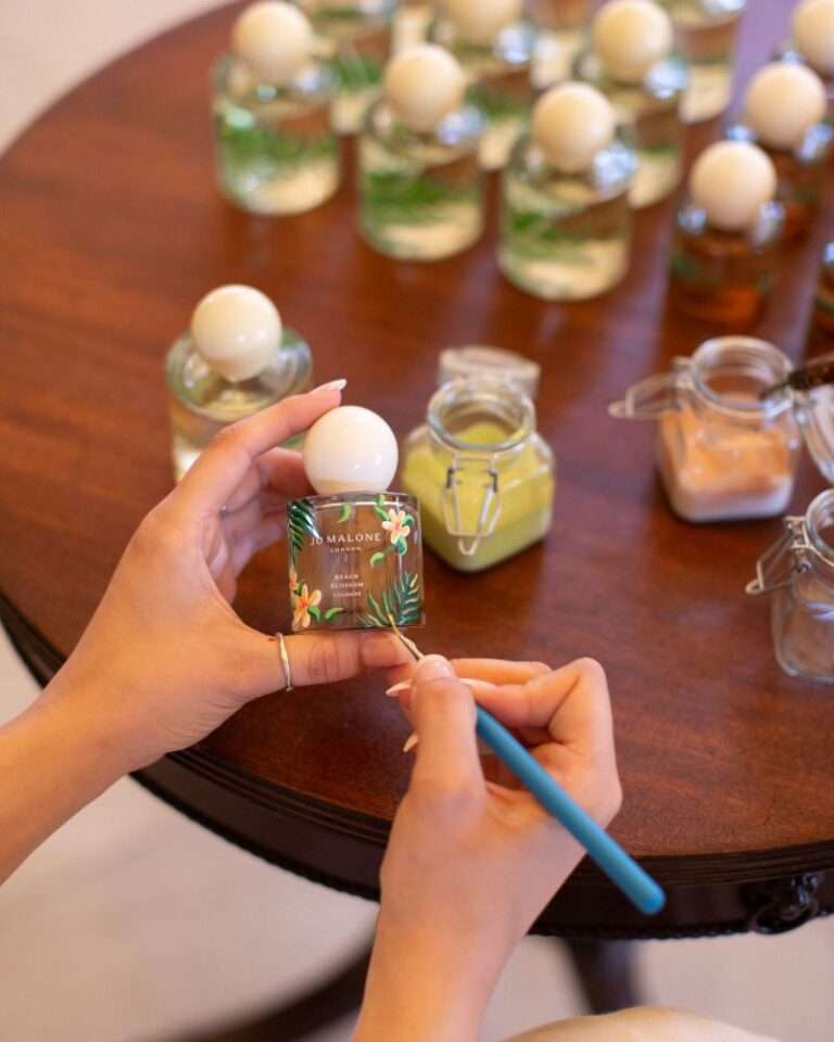hand-painting 80 Jo Malone perfume bottles